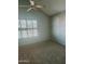 Neutral bedroom with large window providing ample natural light at 5704 E Aire Libre Ave # 1038, Scottsdale, AZ 85254