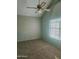 Bedroom featuring carpet floors, a ceiling fan, and bright window at 5704 E Aire Libre Ave # 1038, Scottsdale, AZ 85254
