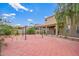 Spacious backyard showcasing a brick-paved area with a gazebo and a covered patio, great for outdoor relaxation at 6118 S 46Th Ave, Laveen, AZ 85339