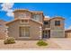 Charming two-story home featuring a well-maintained facade and low-maintenance front yard landscaping at 6118 S 46Th Ave, Laveen, AZ 85339