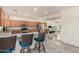 Spacious open concept kitchen featuring stainless steel appliances, granite countertops, and an island with barstool seating at 6118 S 46Th Ave, Laveen, AZ 85339