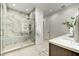 Elegant bathroom featuring a glass-enclosed shower with marble tile, modern fixtures, and a sleek vanity at 6525 E Cave Creek Rd # 101, Cave Creek, AZ 85331