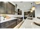 Well-equipped kitchen with stainless steel appliances, marble countertops, and stylish cabinetry at 6525 E Cave Creek Rd # 101, Cave Creek, AZ 85331