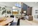 Bright living room with fireplace, large windows, modern chandelier, and stylish decor at 6525 E Cave Creek Rd # 101, Cave Creek, AZ 85331