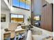 Stunning living room featuring a fireplace, high ceilings, and expansive windows with outside views at 6525 E Cave Creek Rd # 101, Cave Creek, AZ 85331