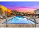 Resort-style community pool featuring lounge chairs, landscaping, and mountain views, perfect for relaxation at 6525 E Cave Creek Rd # 101, Cave Creek, AZ 85331