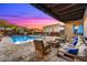 Outdoor poolside lounge area with cozy fire pits and comfortable seating, ideal for evening relaxation and socializing at 6525 E Cave Creek Rd # 101, Cave Creek, AZ 85331