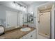 Bathroom with single sink vanity and walk-in shower at 696 W Mesquite St, Chandler, AZ 85225