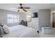 Bright bedroom with a view into the bathroom, dresser, and large window at 696 W Mesquite St, Chandler, AZ 85225