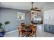 Cozy dining area with wood table and chairs and view into living room at 696 W Mesquite St, Chandler, AZ 85225