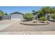 Charming home with a desert landscape, an attached two car garage, and a walkway to the front door at 696 W Mesquite St, Chandler, AZ 85225