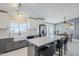Modern kitchen with a large island, stainless steel appliances, and a view to the outdoor living area at 696 W Mesquite St, Chandler, AZ 85225
