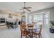 Bright kitchen and dining area with island seating and sliding doors to the backyard at 696 W Mesquite St, Chandler, AZ 85225