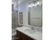 This well-lit bathroom features sleek countertops, updated fixtures, and a glass-enclosed shower, blending form and function at 7222 E Gainey Ranch Rd # 232, Scottsdale, AZ 85258