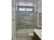 This contemporary bathroom offers a shower over tub and stylish fixtures, creating a spa-like retreat at 7222 E Gainey Ranch Rd # 232, Scottsdale, AZ 85258