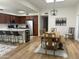 Open-concept kitchen with stainless steel appliances, a kitchen island, and dining area at 7222 E Gainey Ranch Rd # 232, Scottsdale, AZ 85258