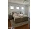 Comfortable bedroom with a plush king-sized bed, soft carpet, and natural light streaming through the windows at 7222 E Gainey Ranch Rd # 232, Scottsdale, AZ 85258