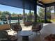 Relaxing covered patio with comfortable seating and a view of the pool at 7222 E Gainey Ranch Rd # 232, Scottsdale, AZ 85258