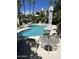Inviting community pool featuring comfortable lounge seating and beautiful landscaping at 7222 E Gainey Ranch Rd # 232, Scottsdale, AZ 85258
