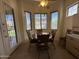 The breakfast nook area features a ceiling fan, access to the patio, and lots of light at 7227 W Paradise Ln, Peoria, AZ 85382
