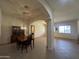 The dining room featuring a tile floor, and adjacent spaces for flexible living at 7227 W Paradise Ln, Peoria, AZ 85382