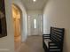 Inviting foyer with tile flooring, bench seating, and a front door with decorative glass inserts at 7227 W Paradise Ln, Peoria, AZ 85382