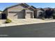 Beautiful single Gathering home with an attached 3-car garage and desert landscaping at 7227 W Paradise Ln, Peoria, AZ 85382