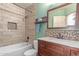 Bathroom with tile backsplash, stylish vanity, and a shower with a tub at 728 E Windsor Dr, Gilbert, AZ 85296
