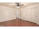 Bedroom featuring a ceiling fan, closet and doorway at 728 E Windsor Dr, Gilbert, AZ 85296