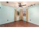 Bedroom with three large windows and a ceiling fan at 728 E Windsor Dr, Gilbert, AZ 85296