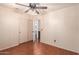Bright bedroom with a ceiling fan and closet for storage at 728 E Windsor Dr, Gilbert, AZ 85296