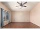 Empty bedroom features neutral walls, a ceiling fan, and natural light at 728 E Windsor Dr, Gilbert, AZ 85296