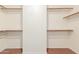 Walk-in closet with built-in shelving and wood-look floors at 728 E Windsor Dr, Gilbert, AZ 85296