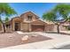 Two-story home featuring desert landscaping, a tile roof, and a two-car garage at 728 E Windsor Dr, Gilbert, AZ 85296