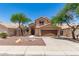 Inviting two-story home with desert landscaping and a two-car garage at 728 E Windsor Dr, Gilbert, AZ 85296