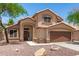 Charming two-story home featuring desert landscaping, a tile roof, and a two-car garage at 728 E Windsor Dr, Gilbert, AZ 85296