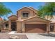 Charming two-story home featuring a tile roof, desert landscaping, and a two-car garage at 728 E Windsor Dr, Gilbert, AZ 85296