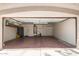 Spacious garage featuring a high ceiling, shelving, and ample storage at 728 E Windsor Dr, Gilbert, AZ 85296