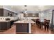 Spacious kitchen featuring dark cabinetry, an island with seating, and stainless steel appliances at 728 E Windsor Dr, Gilbert, AZ 85296
