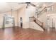 Open-concept living room featuring a staircase, hardwood floors, and natural light at 728 E Windsor Dr, Gilbert, AZ 85296