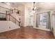 Spacious living room featuring a staircase, hardwood floors, and natural light at 728 E Windsor Dr, Gilbert, AZ 85296