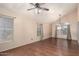 Bright living room featuring vaulted ceilings, hardwood floors, and large windows at 728 E Windsor Dr, Gilbert, AZ 85296