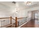 Staircase with wood railing and metal spindles leading to the upper level at 728 E Windsor Dr, Gilbert, AZ 85296