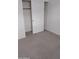 An empty walk in closet off of a bedroom features carpeted floors and a sliding door at 7284 E Gamebird Way, San Tan Valley, AZ 85143