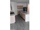 Open kitchen with stainless steel appliances, island sink, and light wood cabinetry at 7284 E Gamebird Way, San Tan Valley, AZ 85143