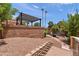 Backyard with gravel, a brick retaining wall and a covered pergola at 841 E Peoria Ave # 2, Phoenix, AZ 85020