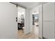 Hallway view of a well-lit bathroom featuring a modern vanity and decor at 841 E Peoria Ave # 2, Phoenix, AZ 85020