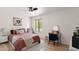 Cozy bedroom featuring a ceiling fan, bright window, and stylish vanity area at 841 E Peoria Ave # 2, Phoenix, AZ 85020