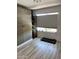 Versatile room with a neutral palette featuring a large wardrobe and treadmill by the window at 841 E Peoria Ave # 2, Phoenix, AZ 85020