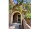 Inviting home entrance featuring a charming arched entryway and mature landscaping at 841 E Peoria Ave # 2, Phoenix, AZ 85020